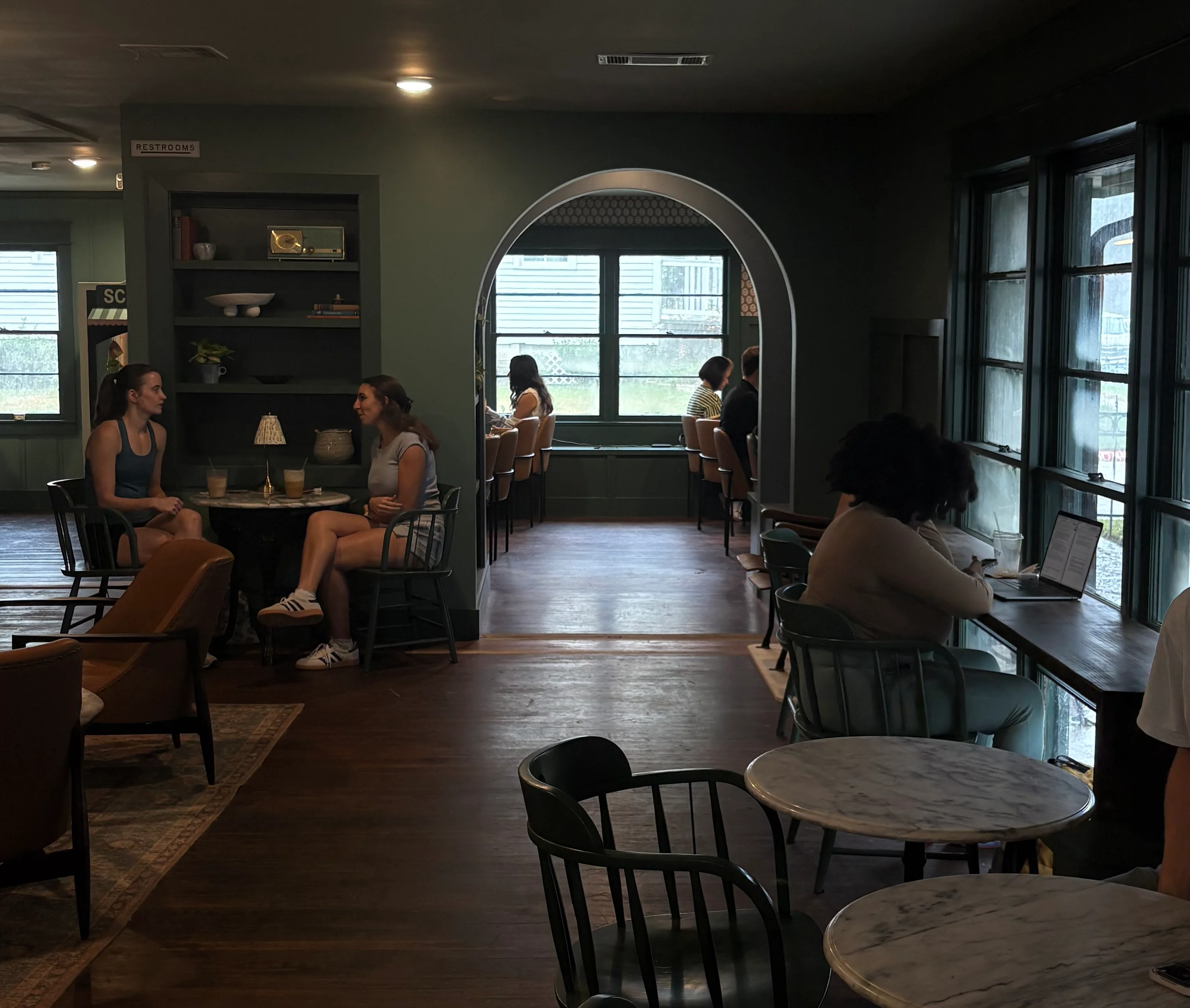 Coffee cup from Wayside Coffee Co. in a cozy café setting
