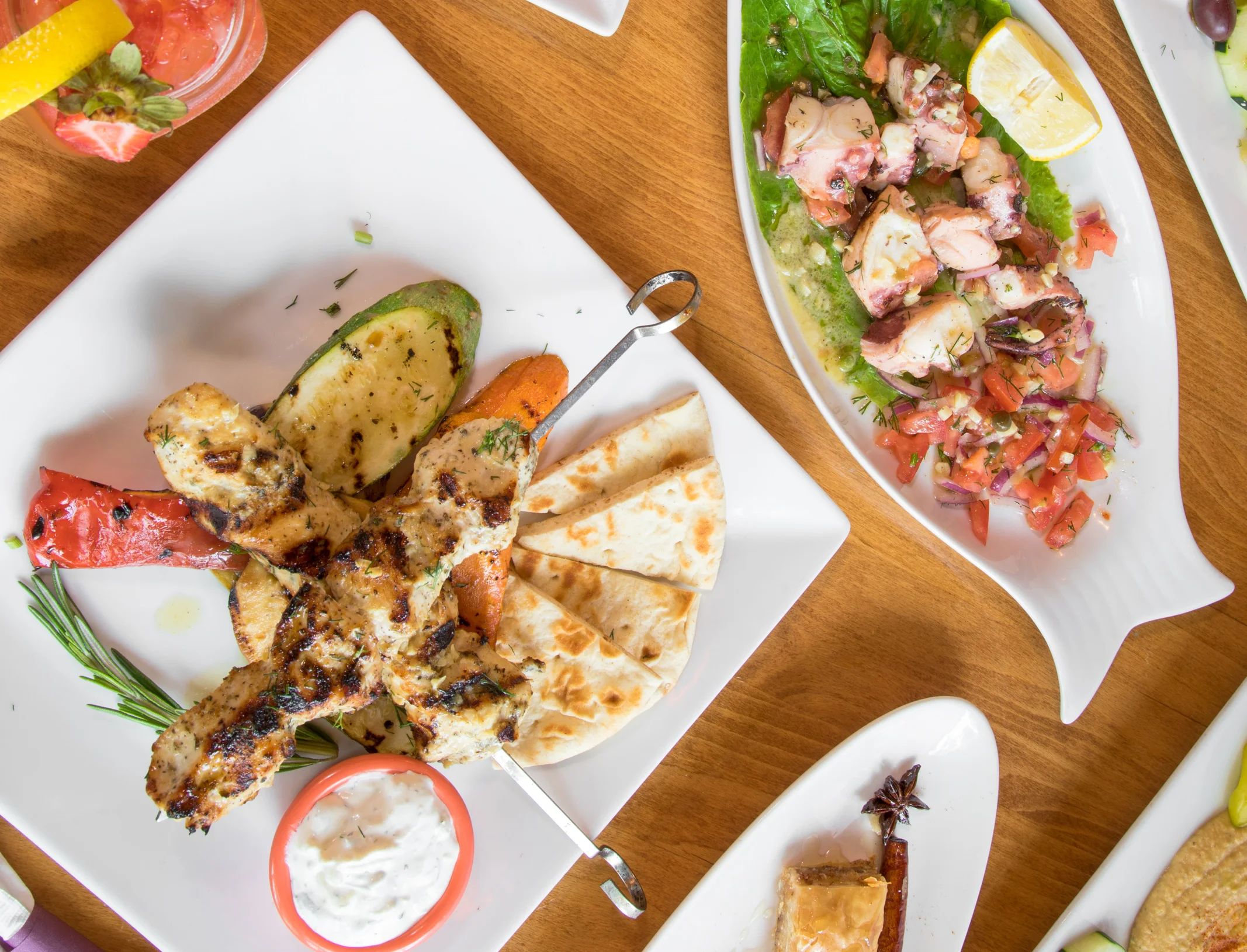 Mixed grill platter featuring kebabs and shrimp