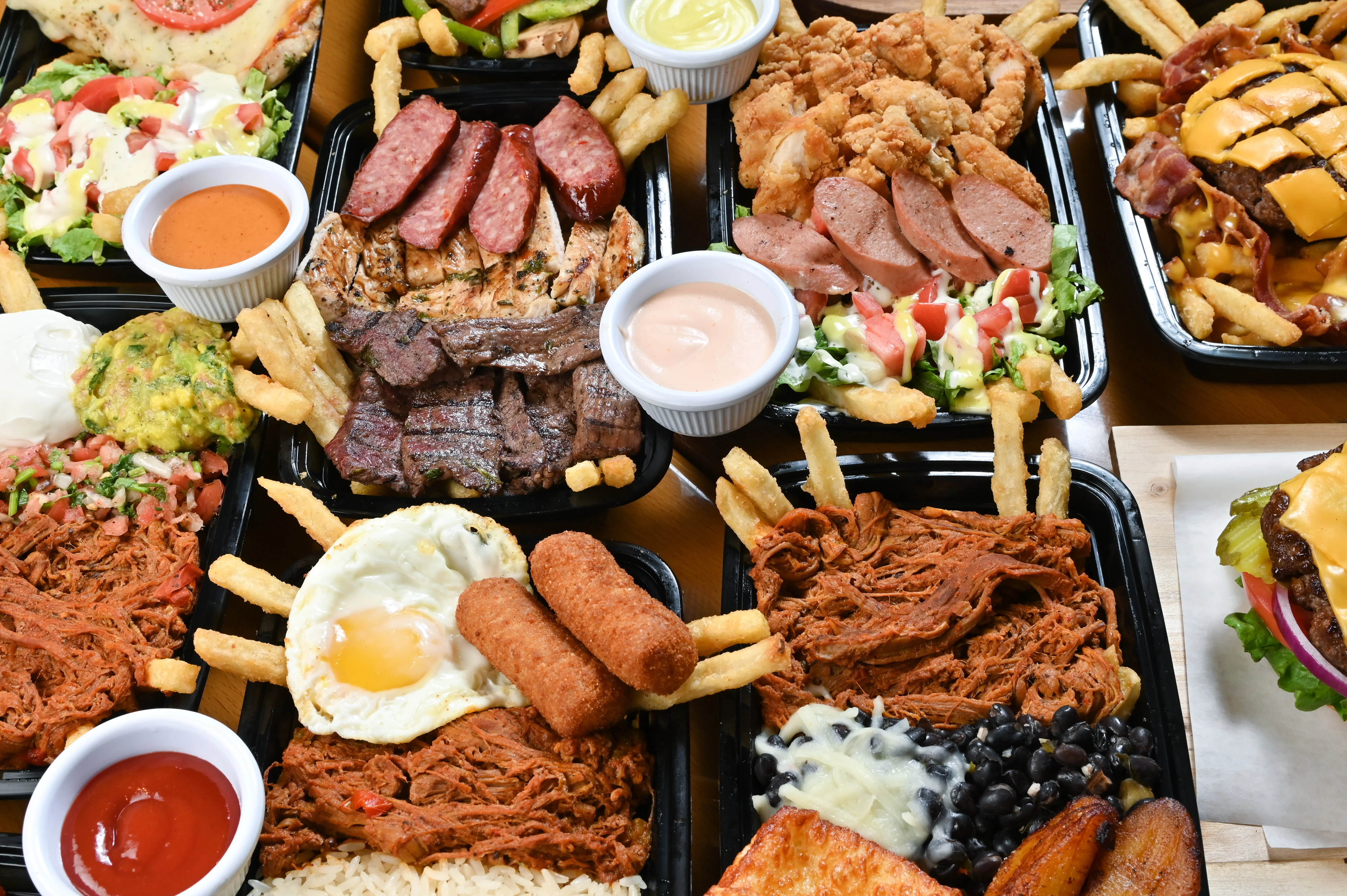 Variety of Latin American dishes with meats and sides