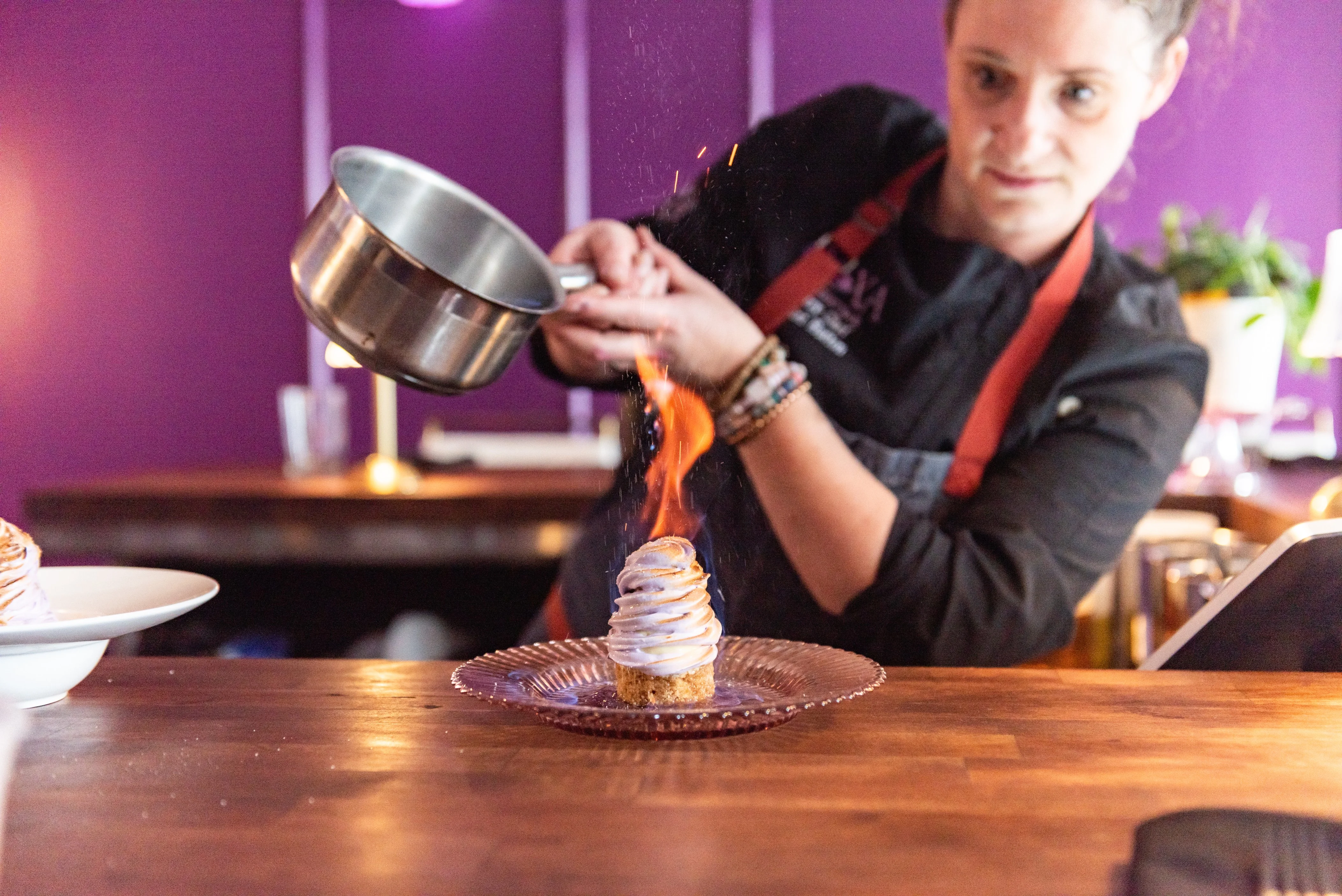 A vibrant restaurant banner featuring a warm fire theme.