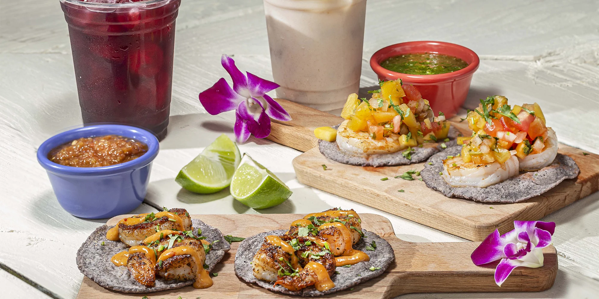 Delicious shrimp tacos with mango salsa on blue corn tortillas