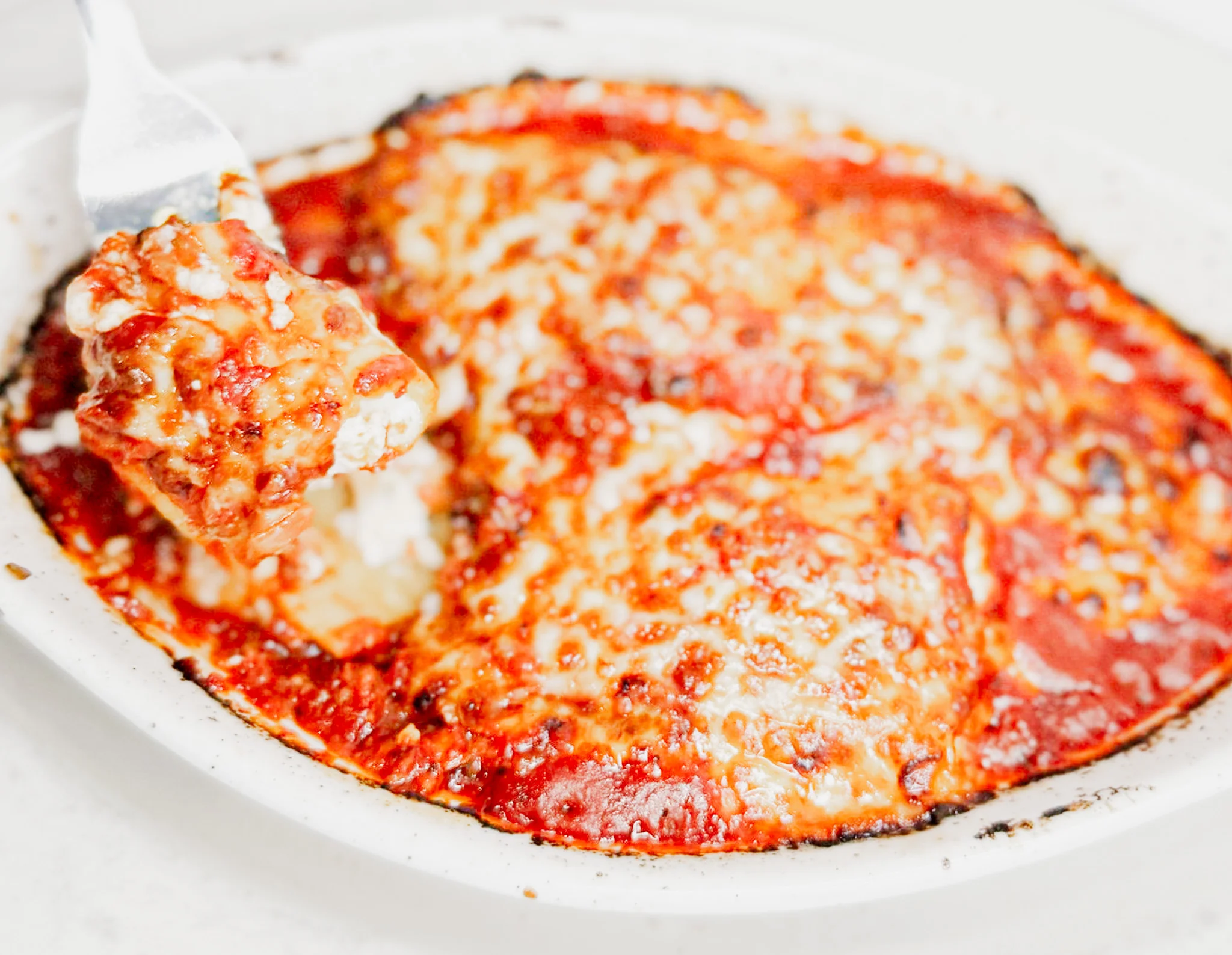 Baked Italian lasagna with rich tomato sauce and melted cheese