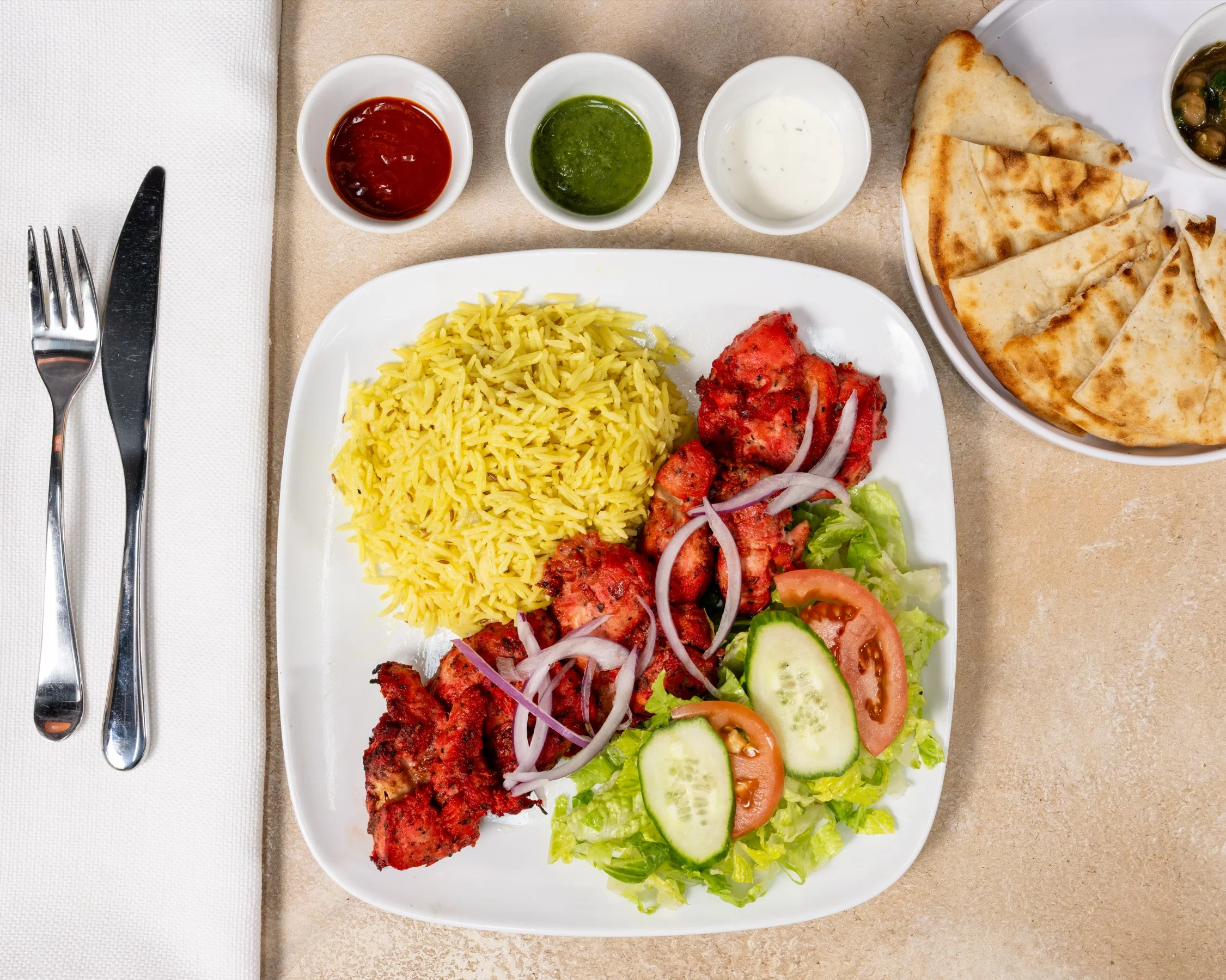 Tandoori chicken platter with saffron rice and naan