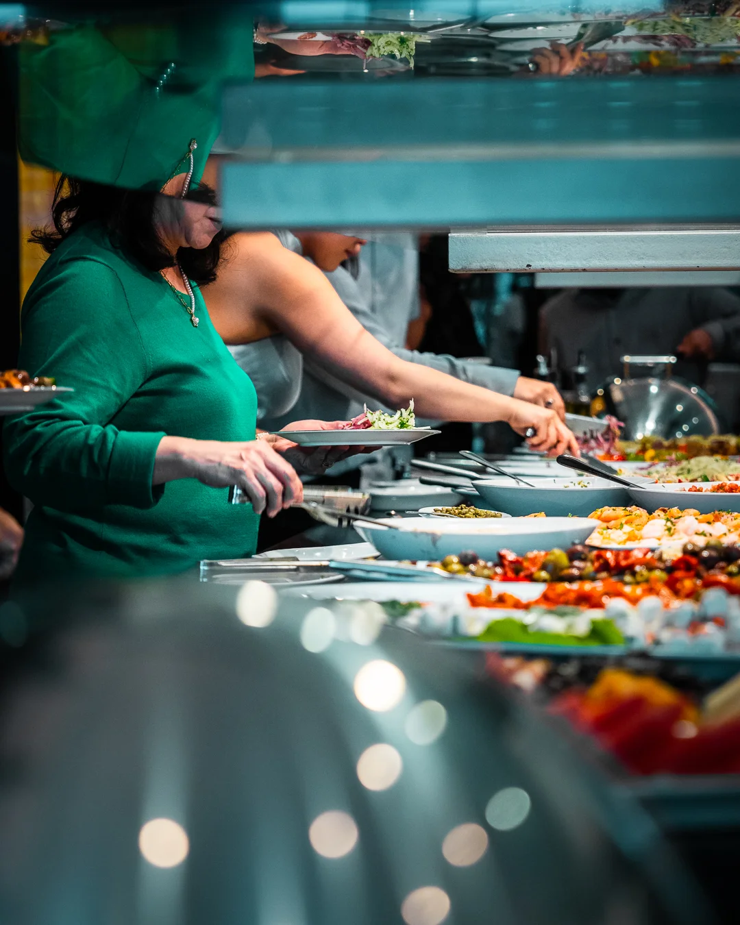 Buffet spread with diverse dishes in a vibrant restaurant setting