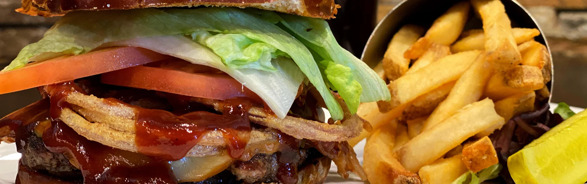 Juicy American cheeseburger with fries