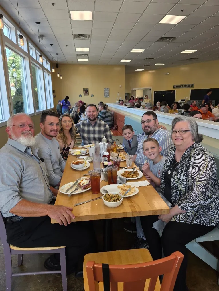 Family enjoying a meal in a vibrant restaurant setting