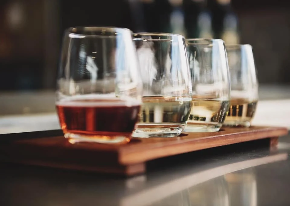 Tasting flight of assorted spirits in elegant glasses