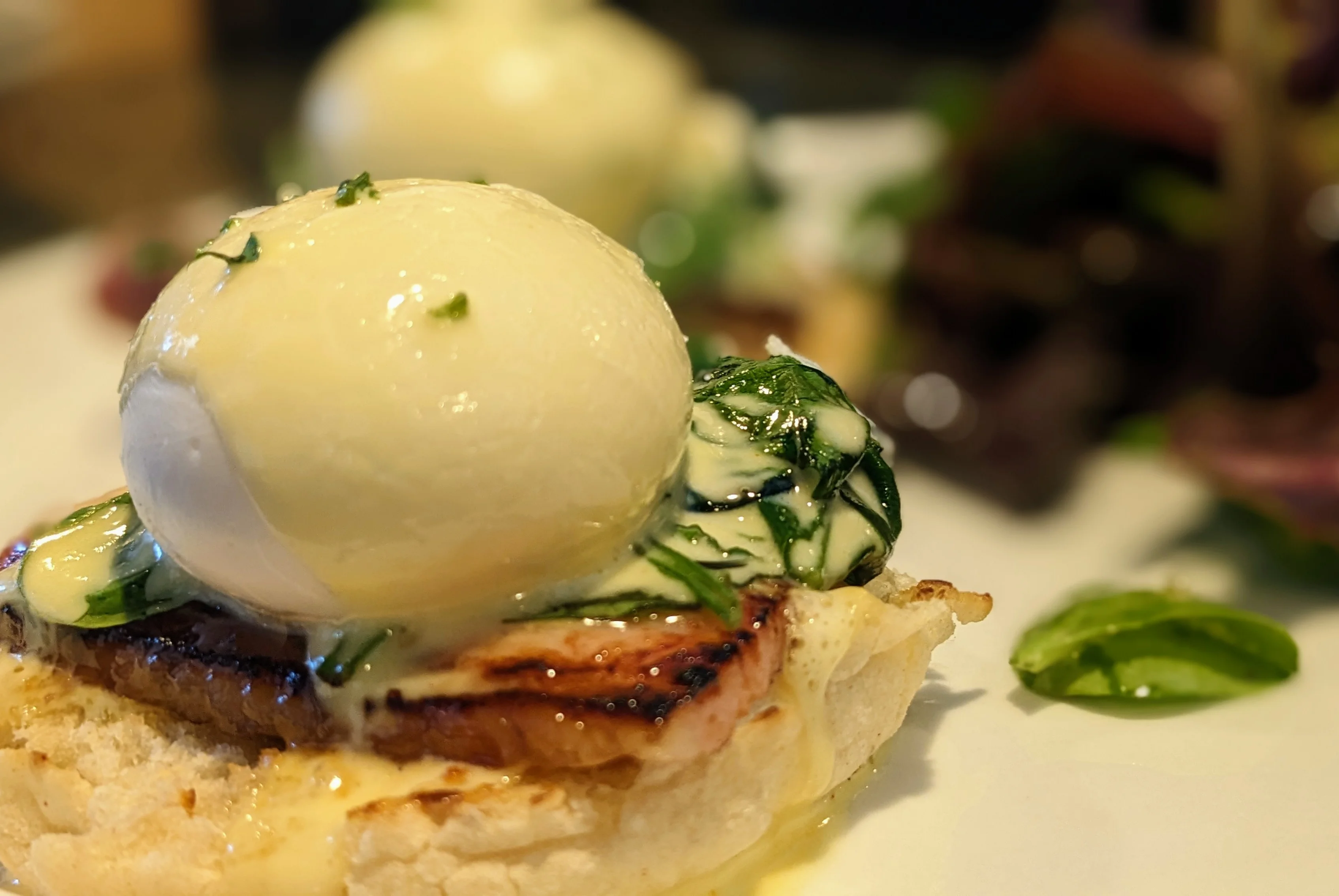 Eggs Benedict with spinach on toasted English muffin