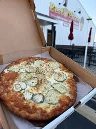 Delicious pizza with toppings on a wooden table