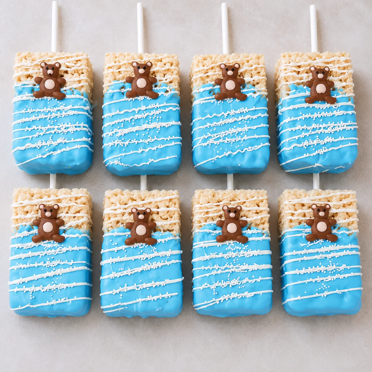 Colorful bear-themed rice crispy treats on sticks