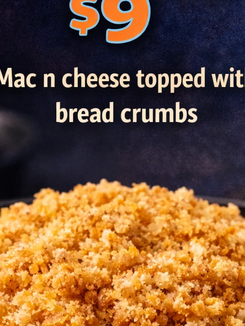 A bowl of creamy macaroni and cheese topped with crispy bread crumbs, creating a delicious and classic comfort food dish.
