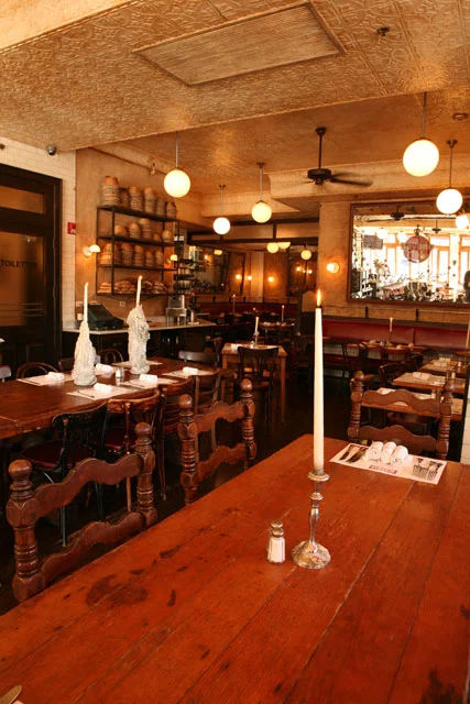 Cozy restaurant interior with wooden tables and warm lighting