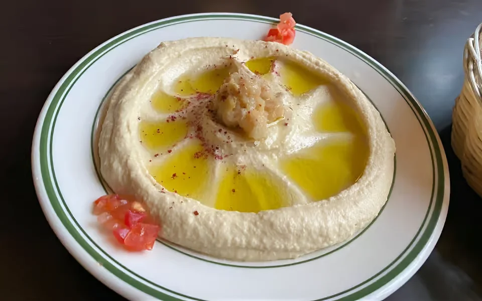 Creamy hummus drizzled with olive oil, a classic Middle Eastern dish