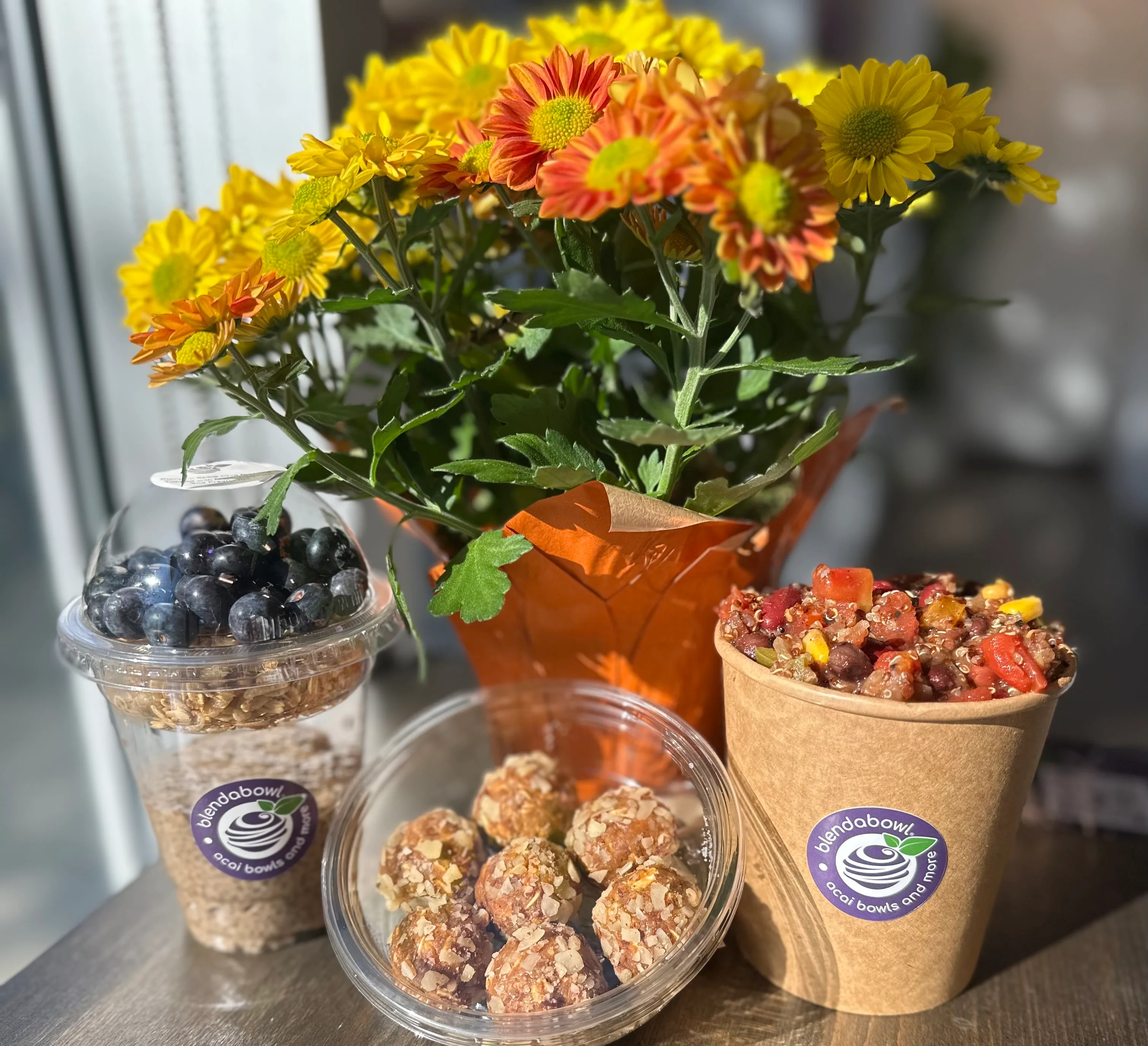 Image of flowers behind chia pudding parfait, balls and chili