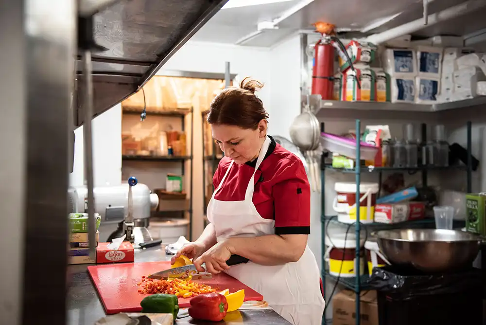 A restaurant chef preparing a dish