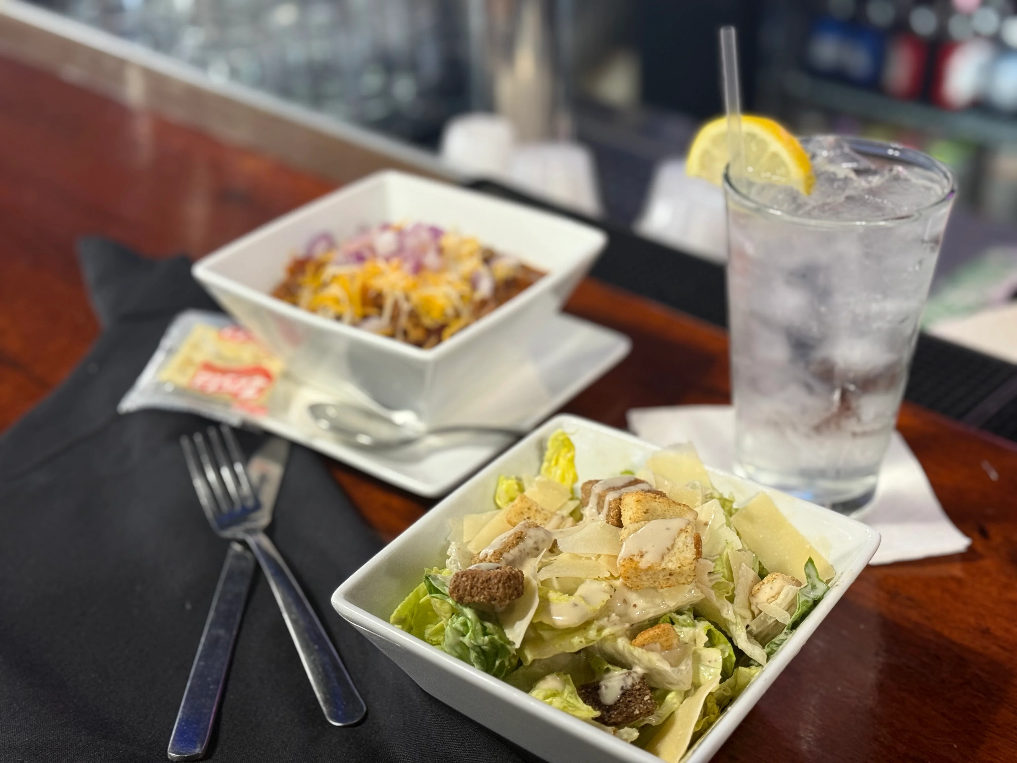 Caesar salad with grilled chicken and a refreshing drink