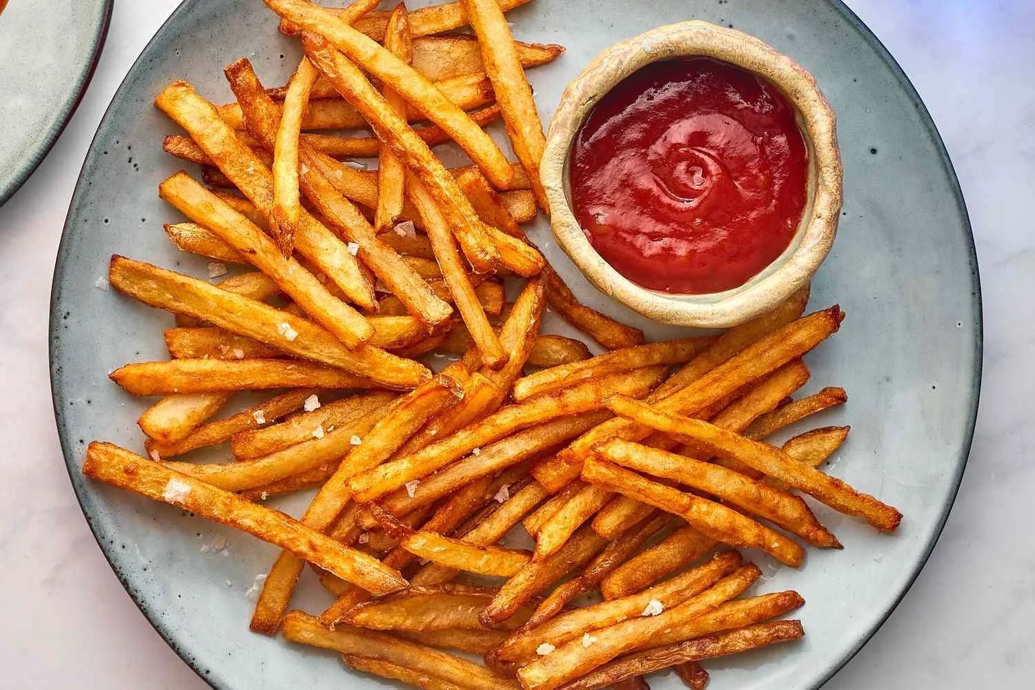 Crispy French fries served with ketchup