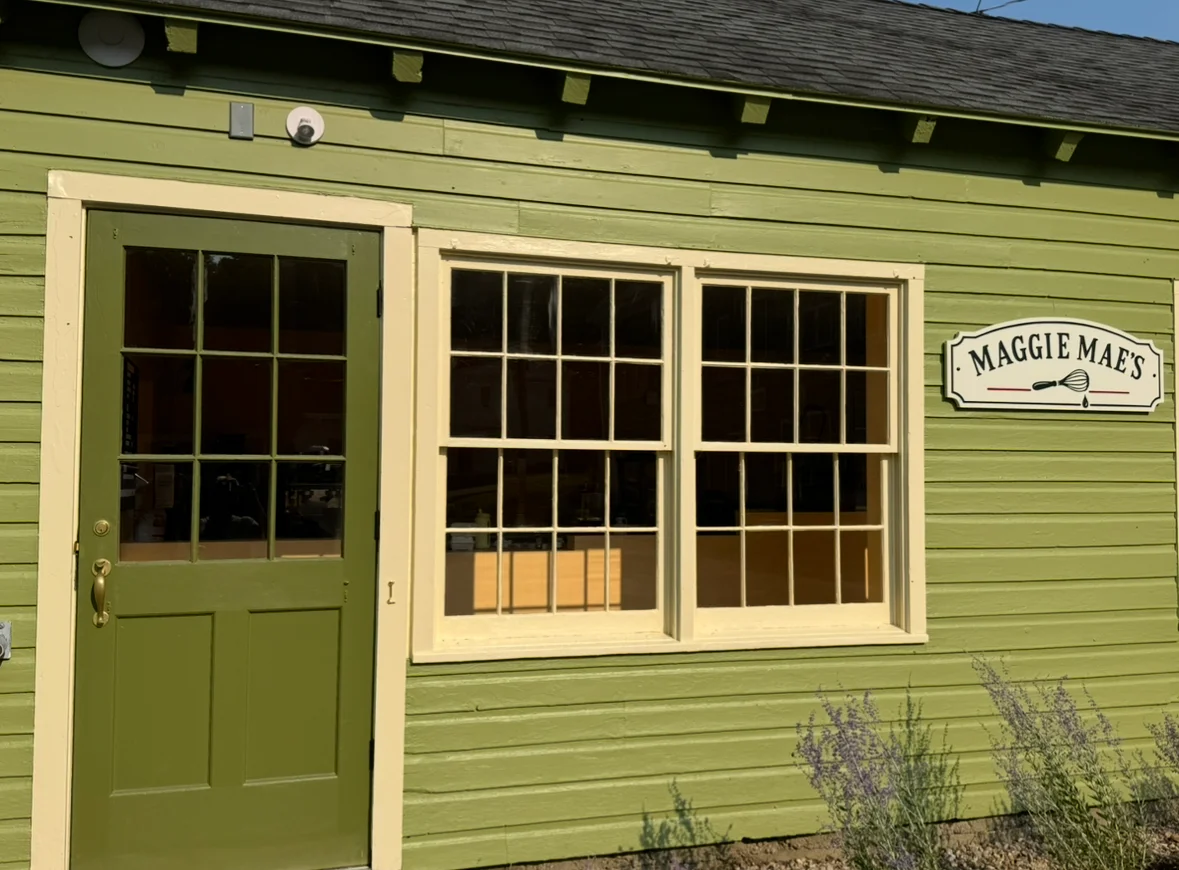 Charming restaurant exterior with green siding and welcoming entrance