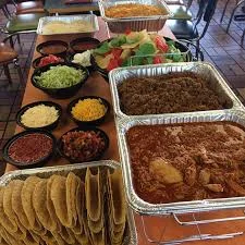 Mexican taco bar with assorted toppings and fillings