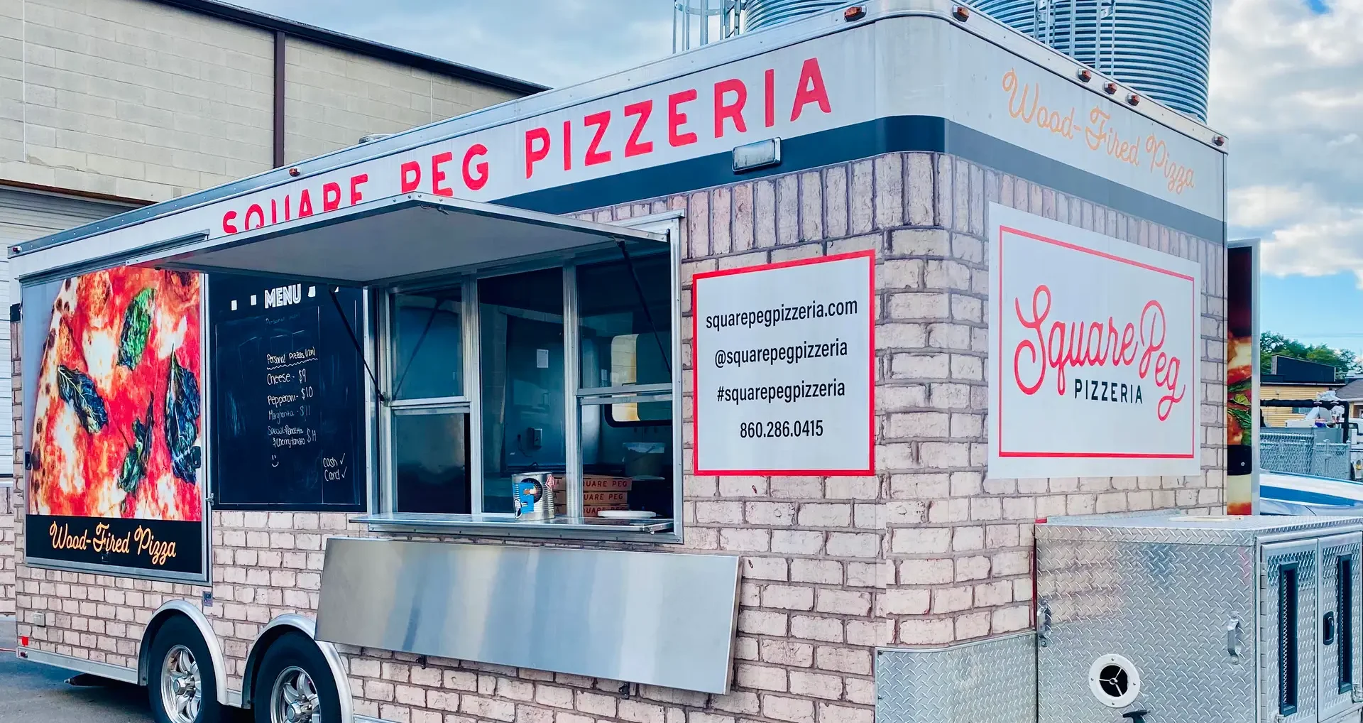 Square Peg Pizzeria food truck serving wood-fired pizza