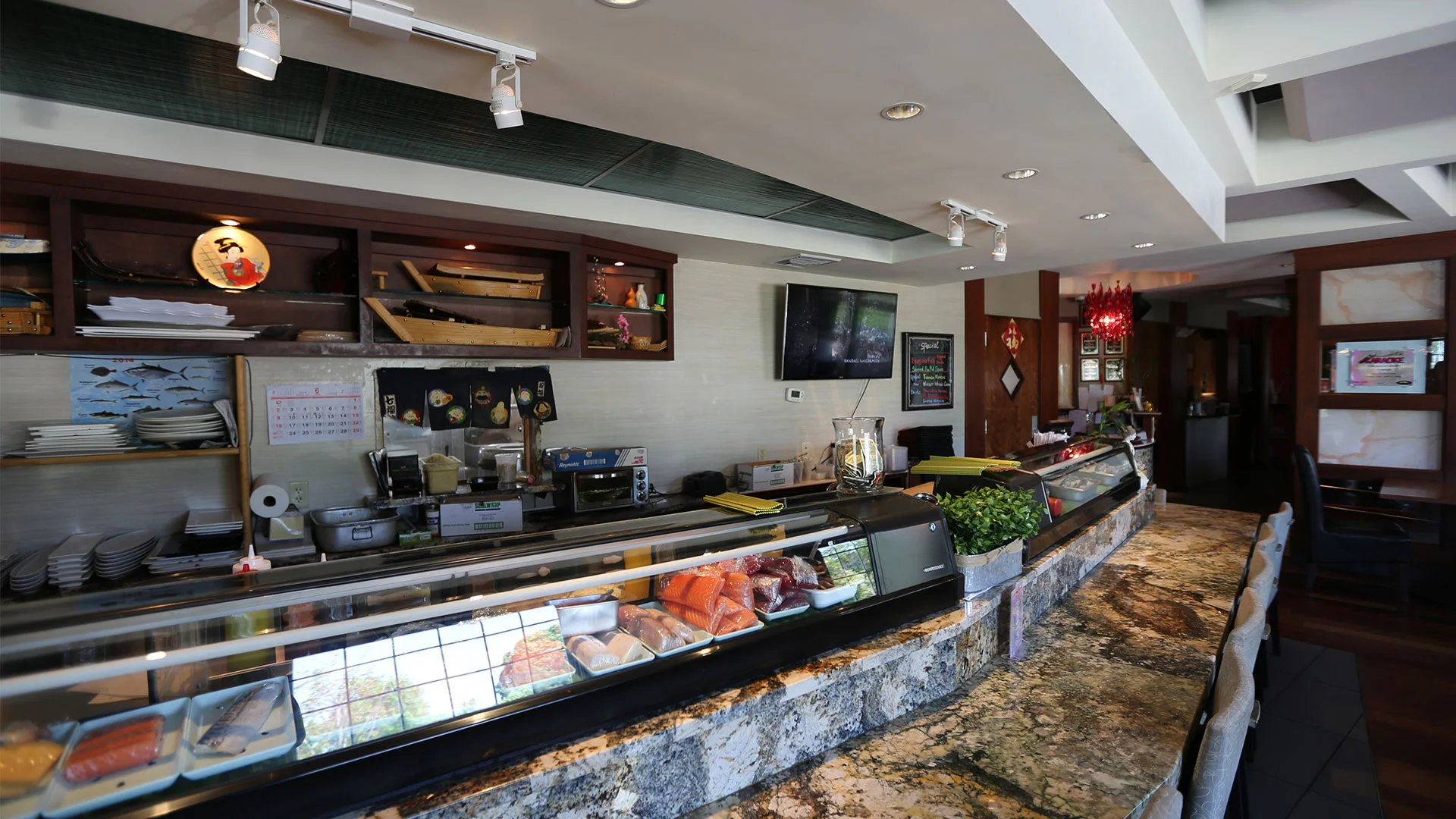 Sushi bar interior with fresh seafood display