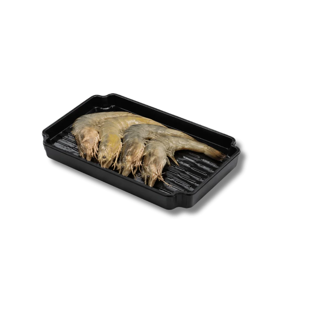 Fresh shrimp displayed in a black tray ready for cooking.