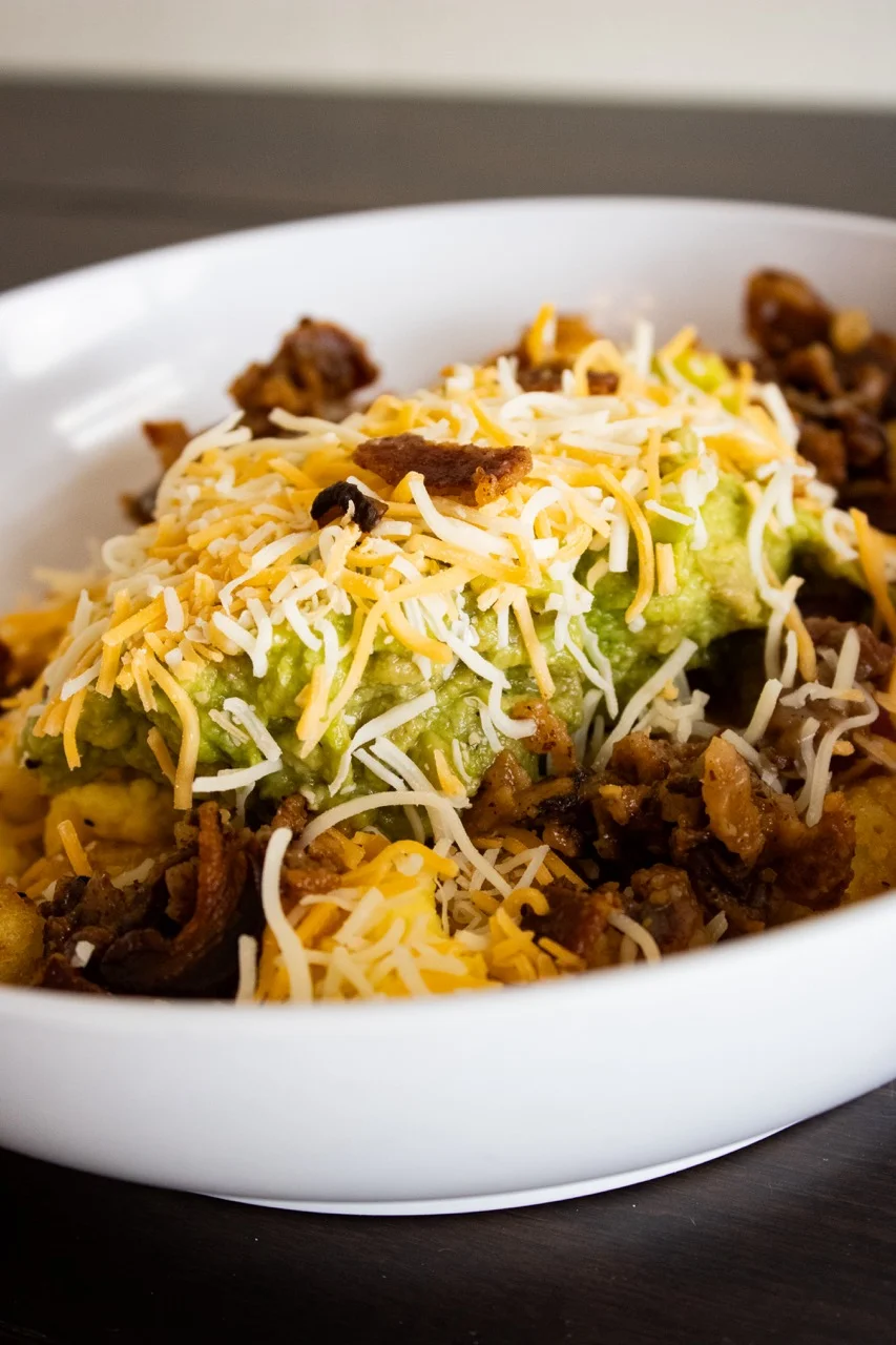 B-Side Coffee Bar’s Avocado Bacon Hash with golden tots, bacon, avocado, scrambled eggs, onions, peppers, and cheese in Huber Heights, Ohio.