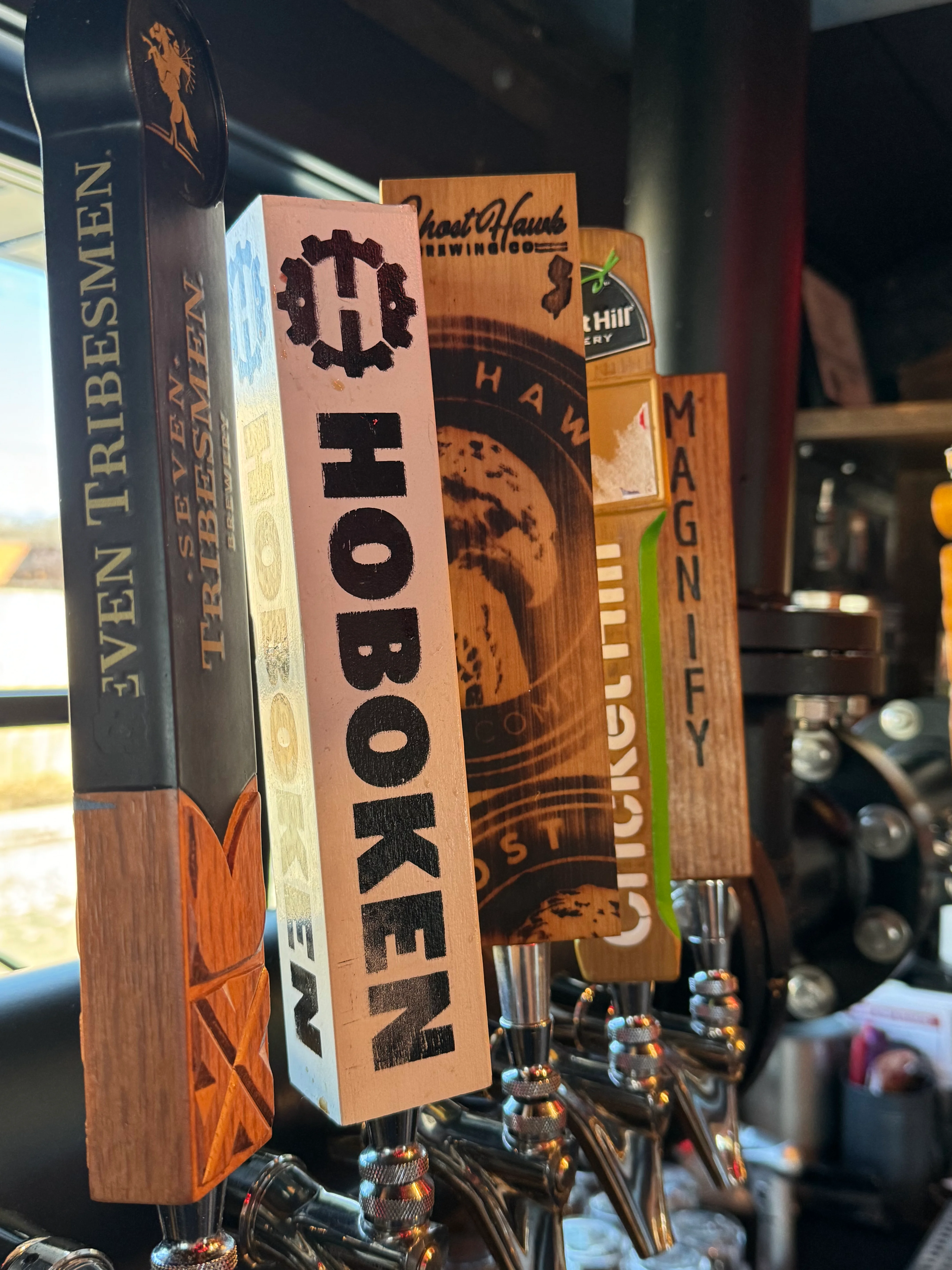 Craft beer taps featuring various local brews