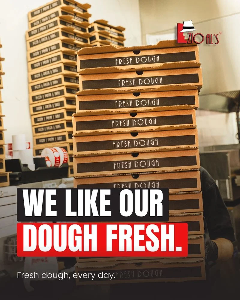 Zio Al's: Pizza for everyone. Big tables, family recipes, room for one more — family owned in DFW, two pizzas in open boxes