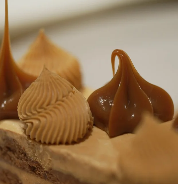 Decadent caramel mousse cake with chocolate layers
