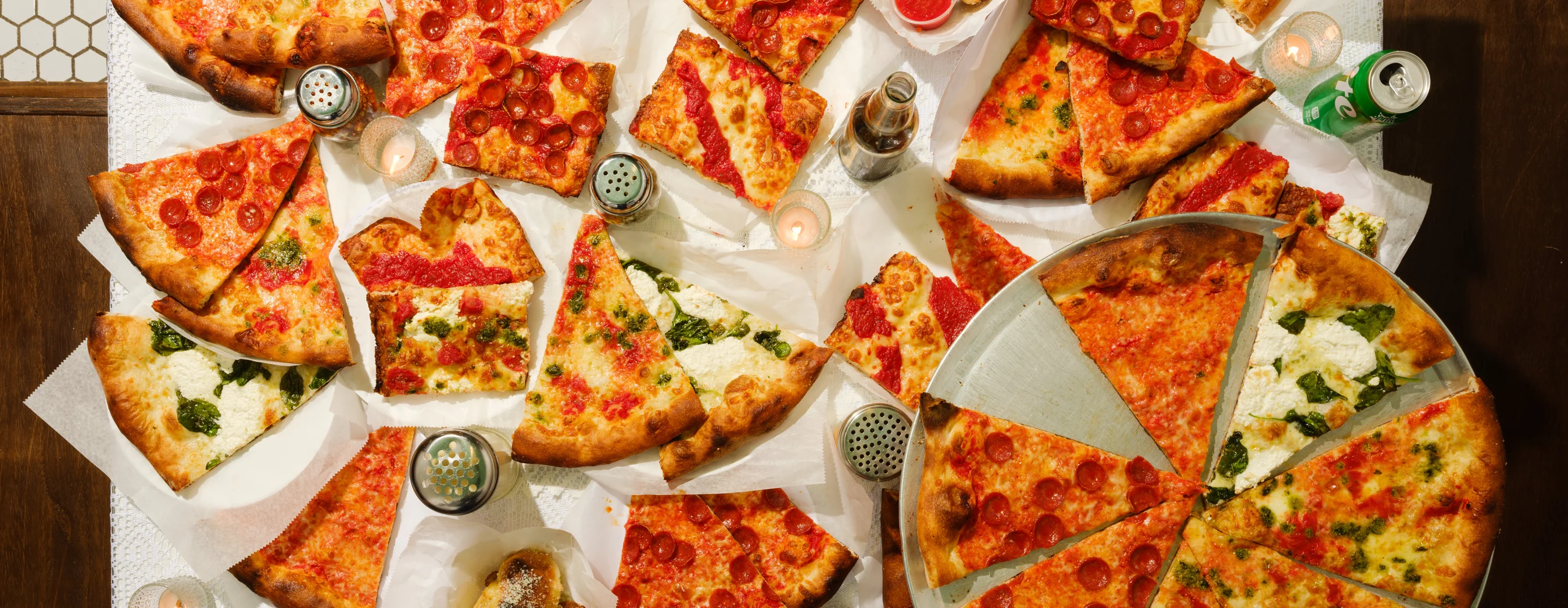Variety of New York-style pizzas on a table