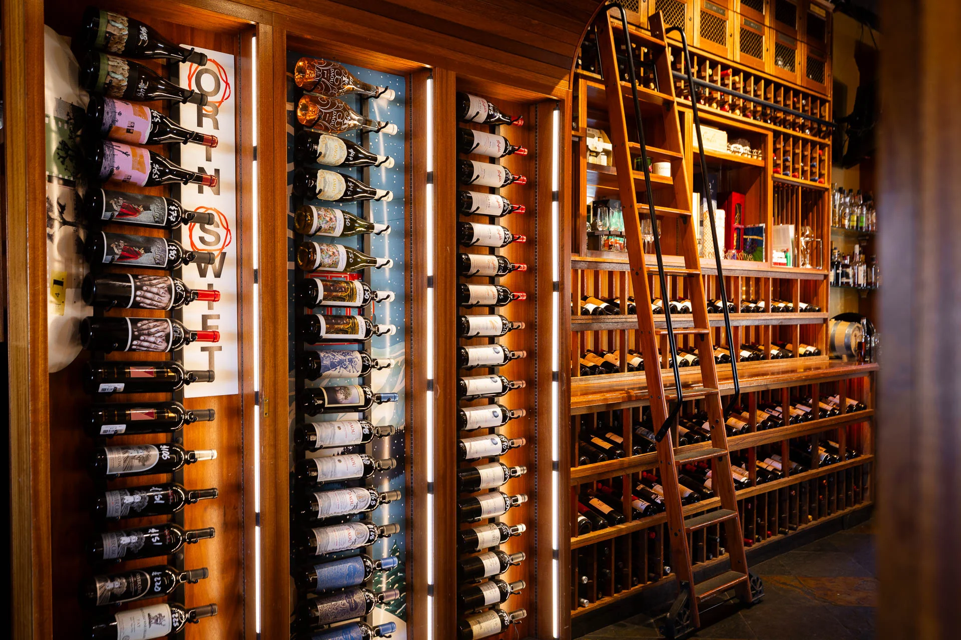 Wine and food served at Side Door Wine Bar & Café, inviting guests to visit the cozy café and enjoy a curated dining experience in Mammoth Lakes.
