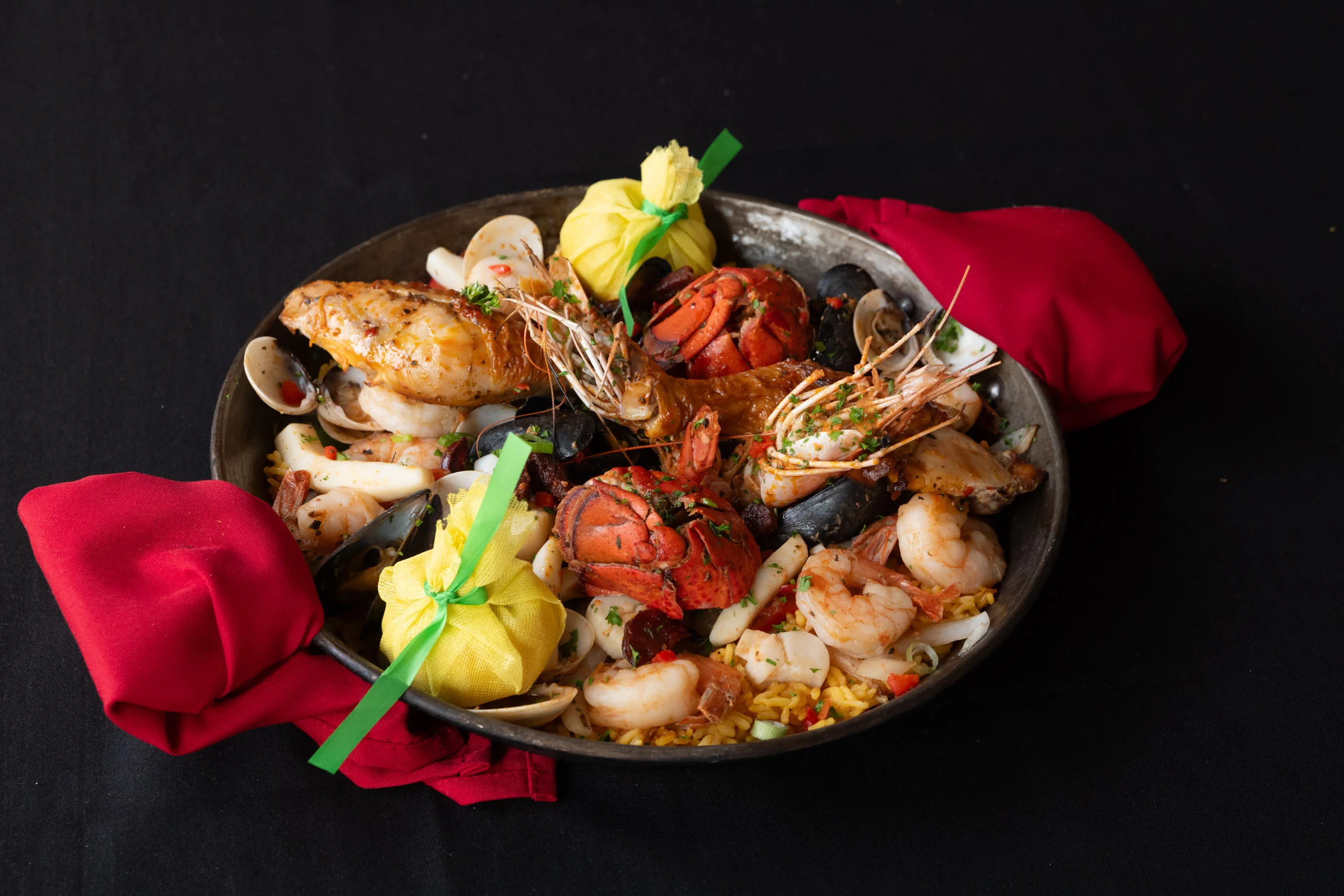 Seafood paella with shrimp, lobster, and clams