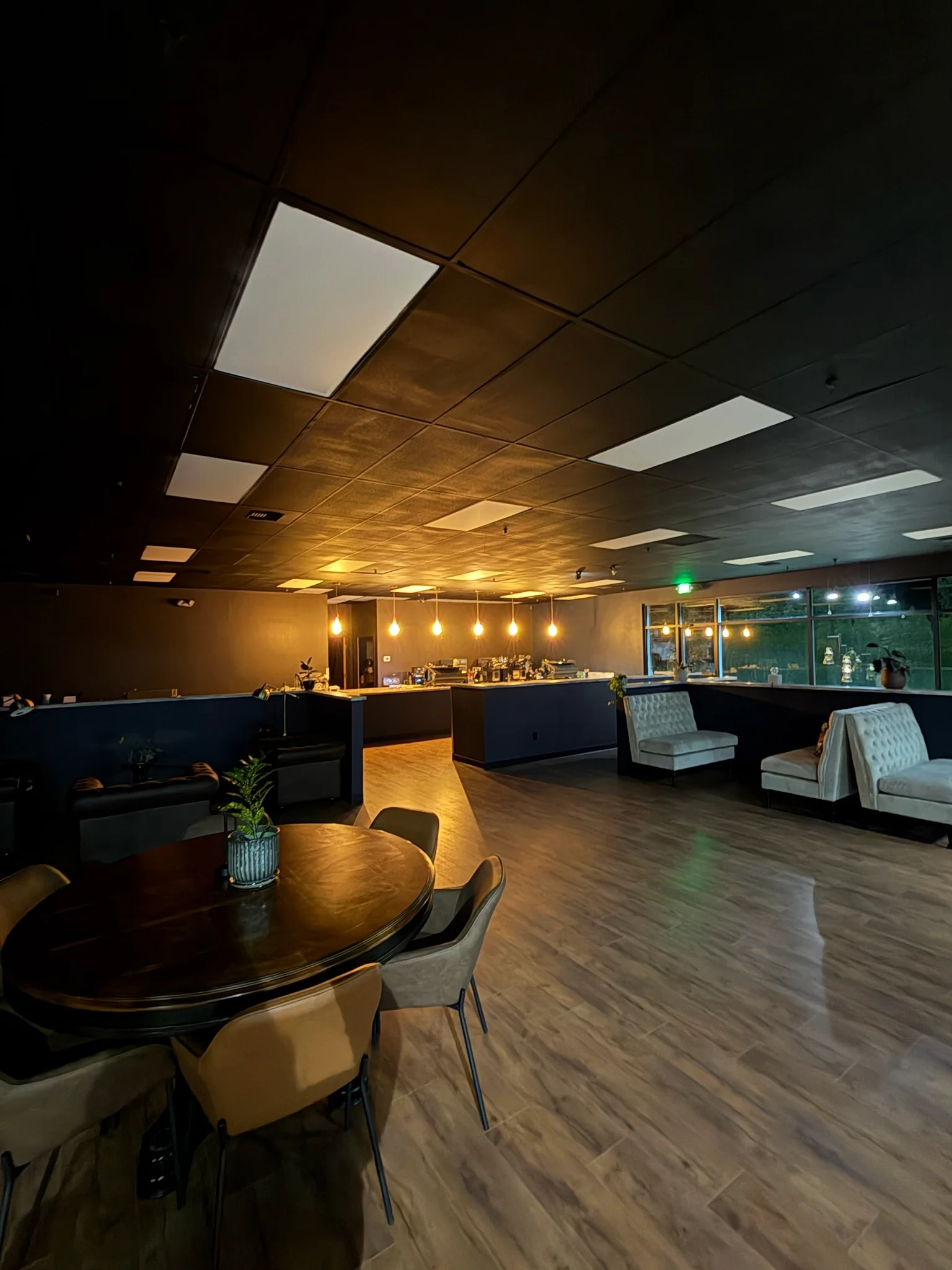 Modern restaurant interior with stylish lighting and seating