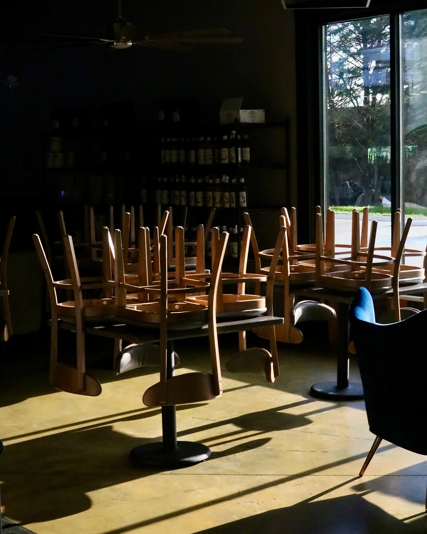Empty restaurant interior with chairs stacked on tables