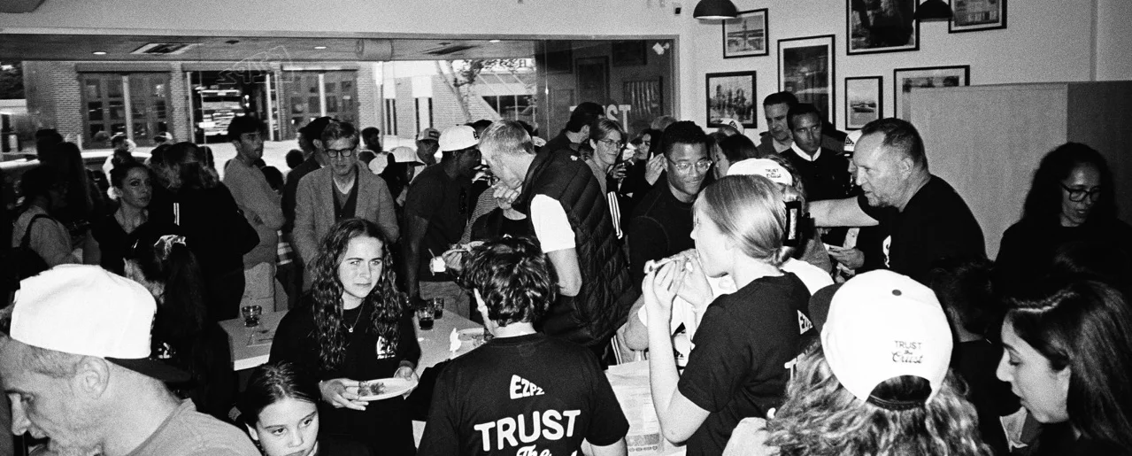 Busy restaurant interior with guests enjoying food and drinks