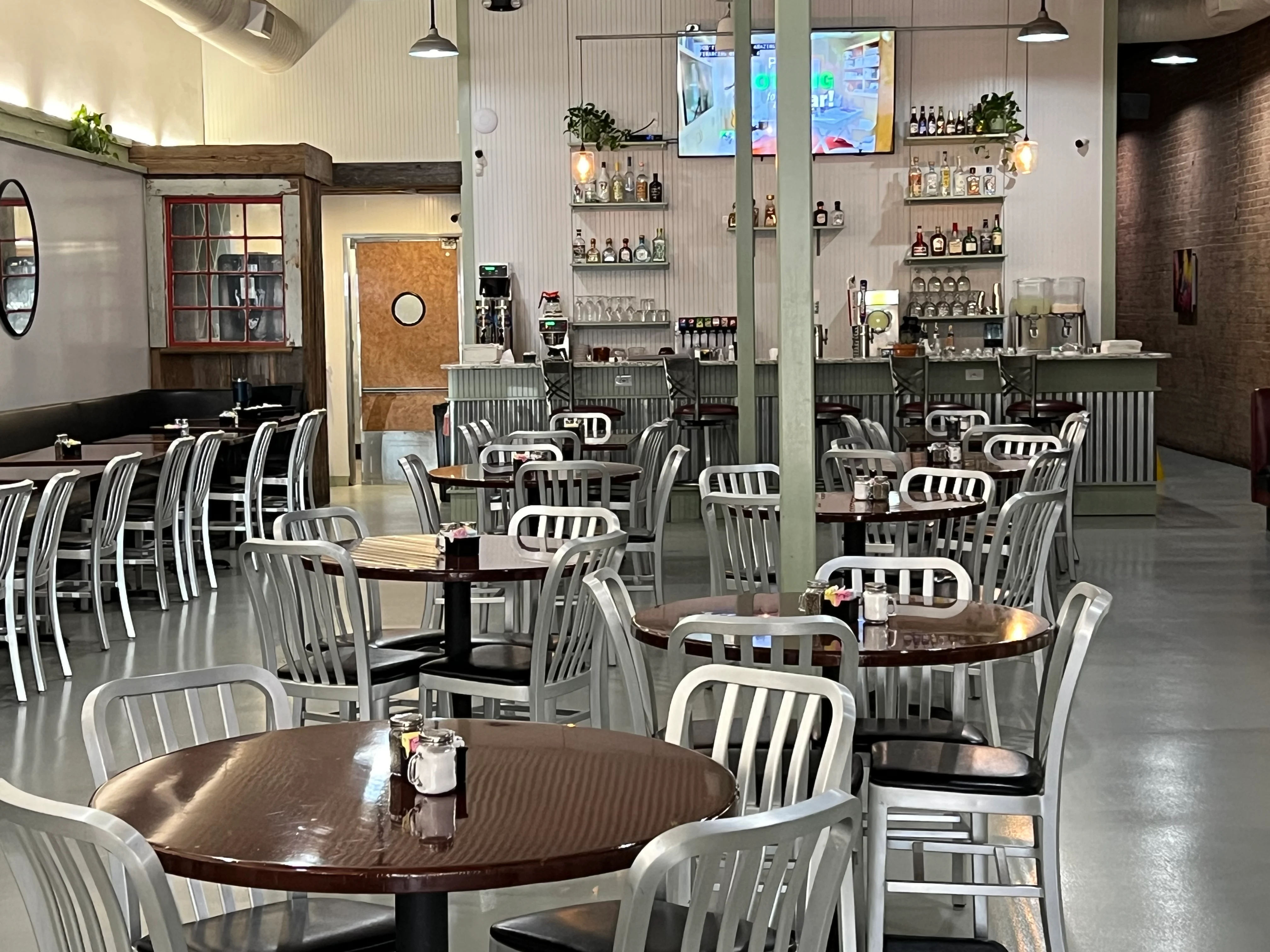 Cozy restaurant interior with modern decor and bar area