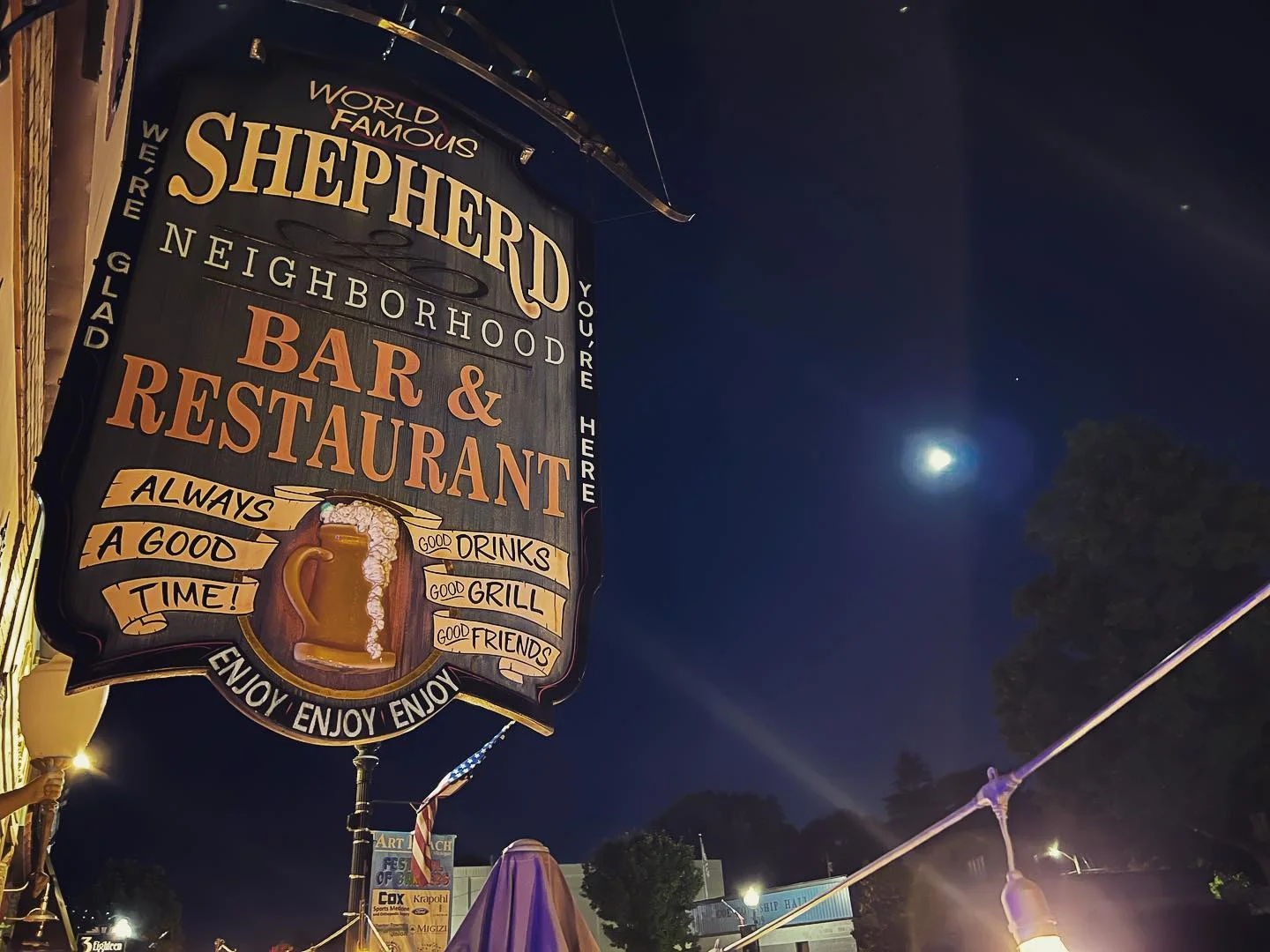 Illuminated restaurant sign at night