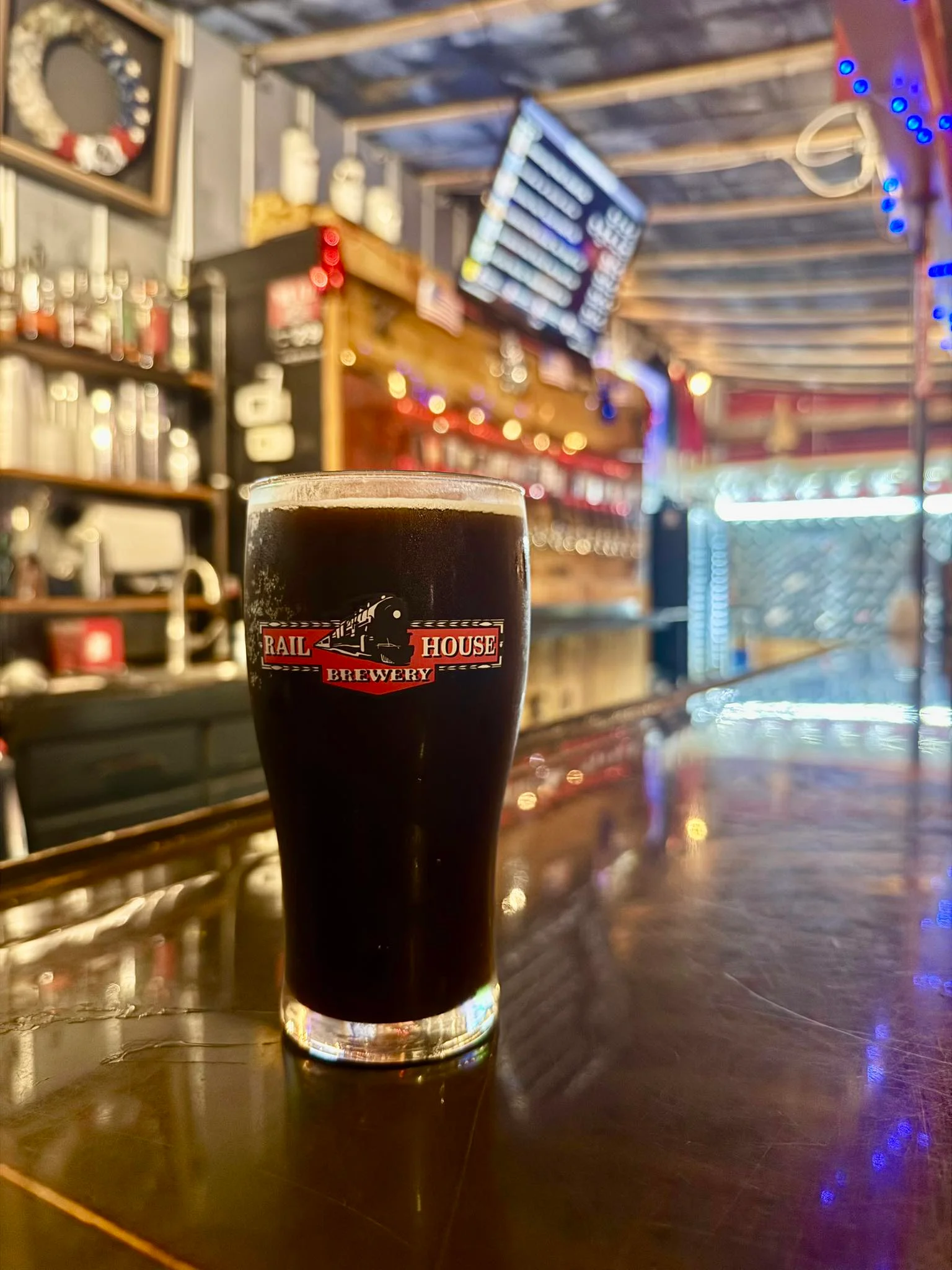 Craft beer served in a brewery glass on a bar counter