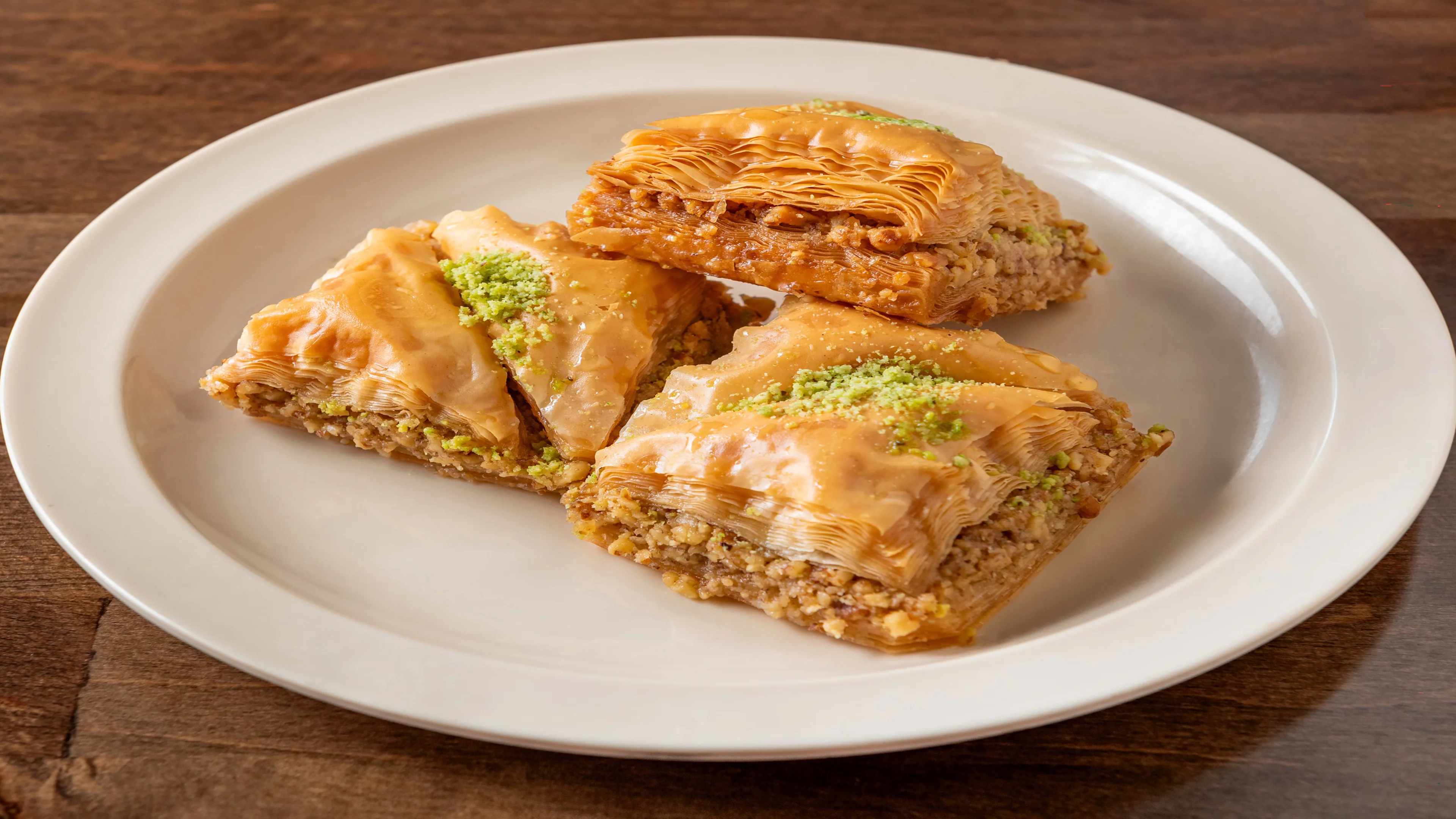 Pita Zone baklava pastries topped with chopped nuts