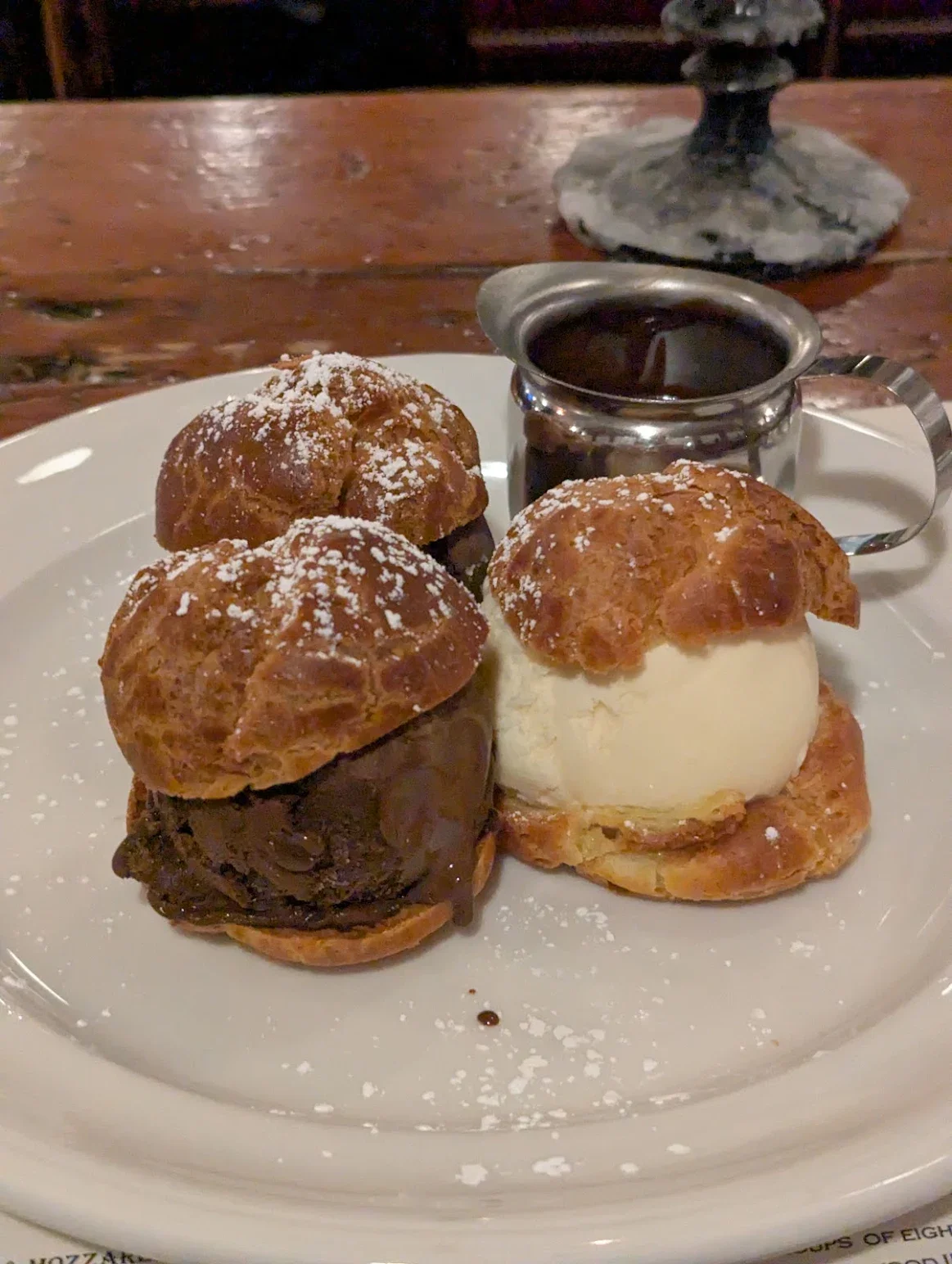 Decadent chocolate and vanilla ice cream sandwiches with rich chocolate sauce