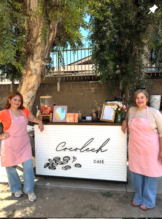Cocolech Café outdoor setup with staff in aprons