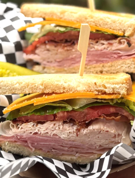 Classic deli sandwich with layers of meat and fresh vegetables