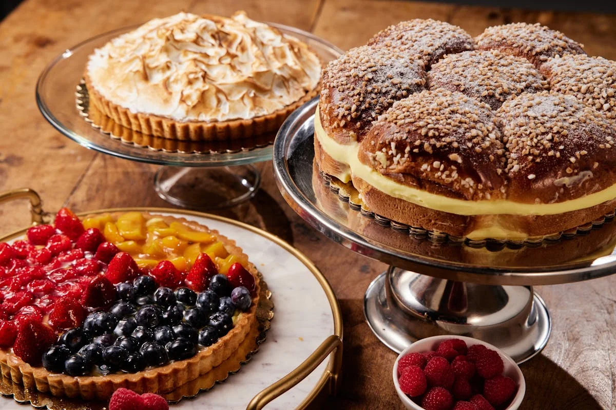 Assorted desserts including fruit tart and cream-filled pastry