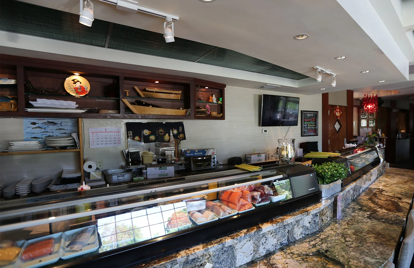 Sushi bar interior with fresh seafood display