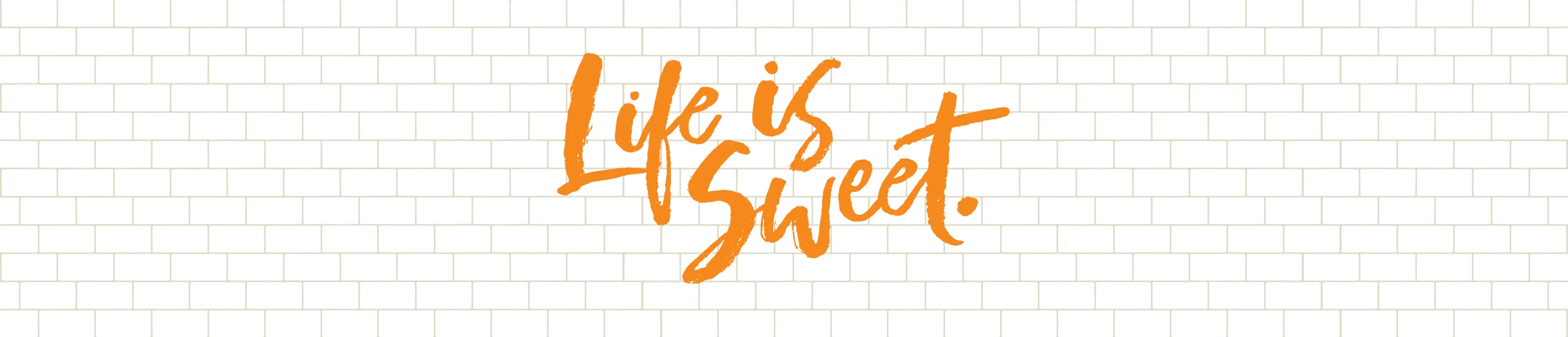 Inspirational quote 'Life is Sweet' on a tiled background