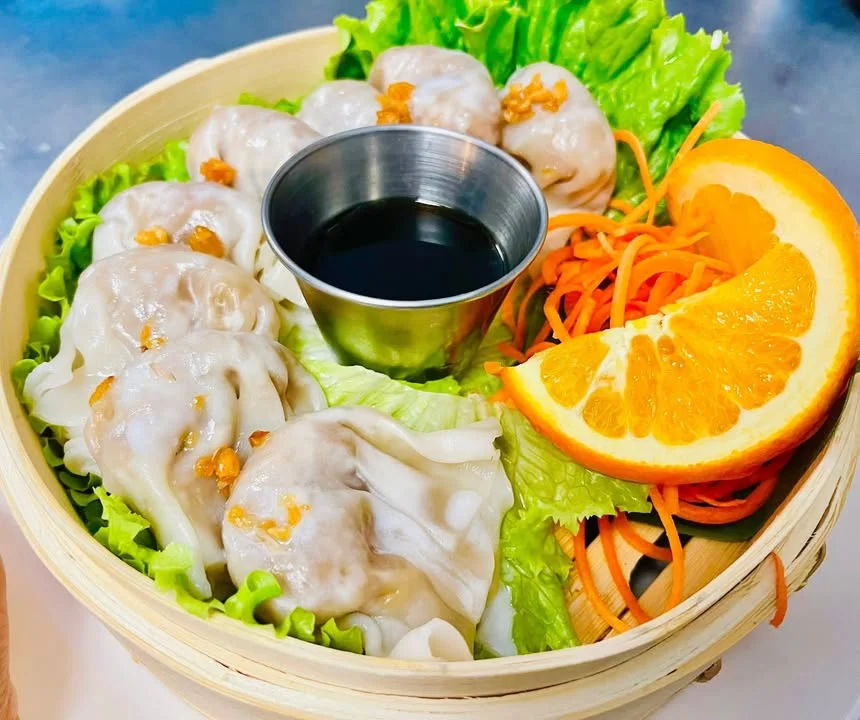 Steamed Chinese dumplings with soy sauce