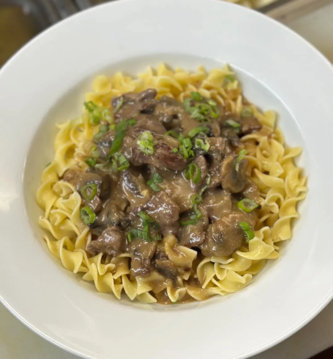Beef stroganoff served over egg noodles