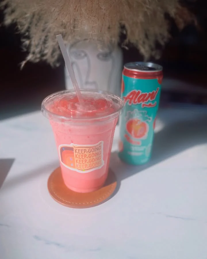 Refreshing pink smoothie with a can of flavored soda