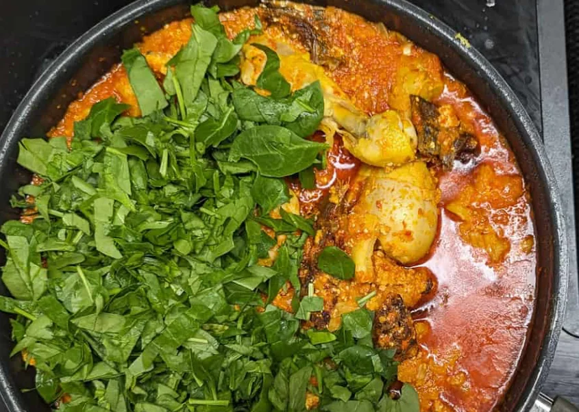 Egusi being prepared in a kitchen pot